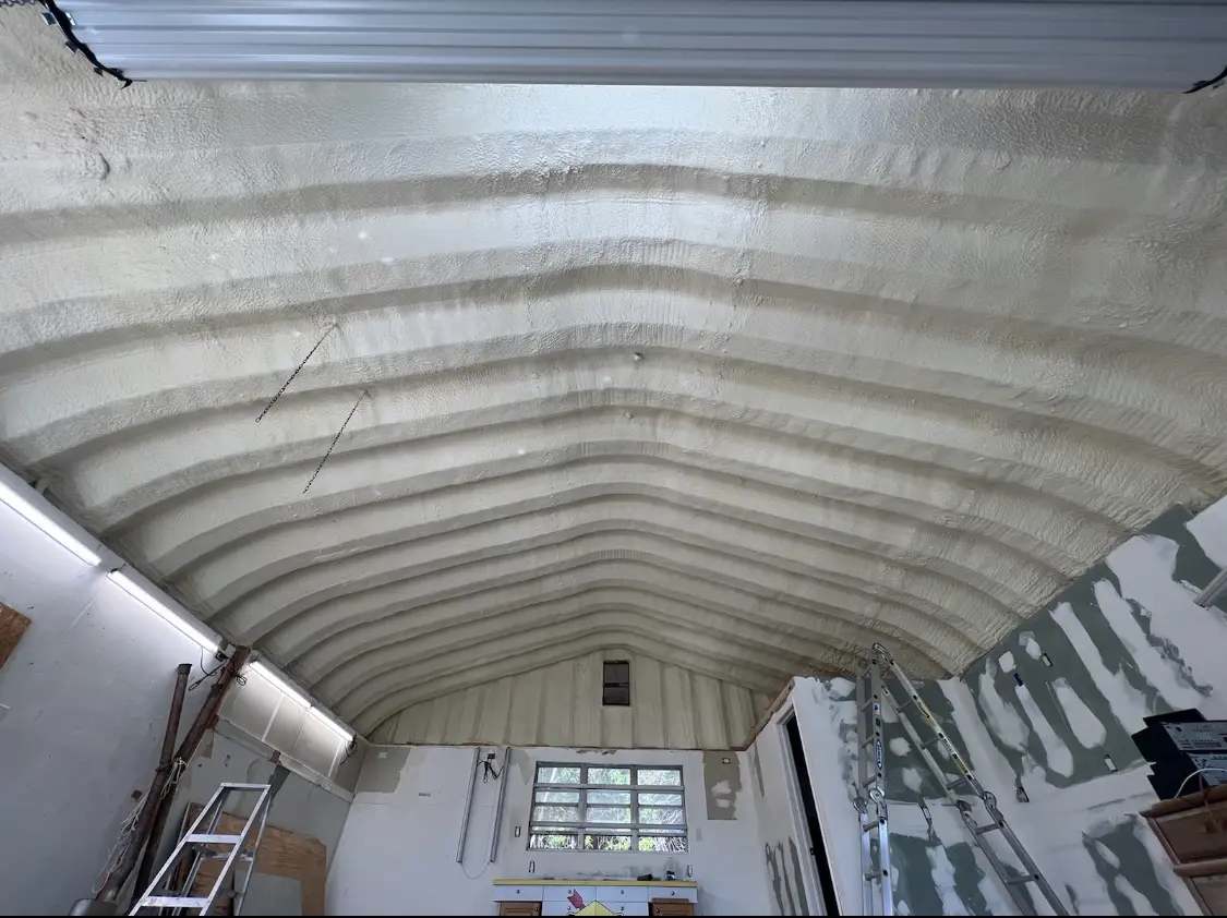 Spray polyurethane foam applied to the underside of a metal roof deck in Cayce